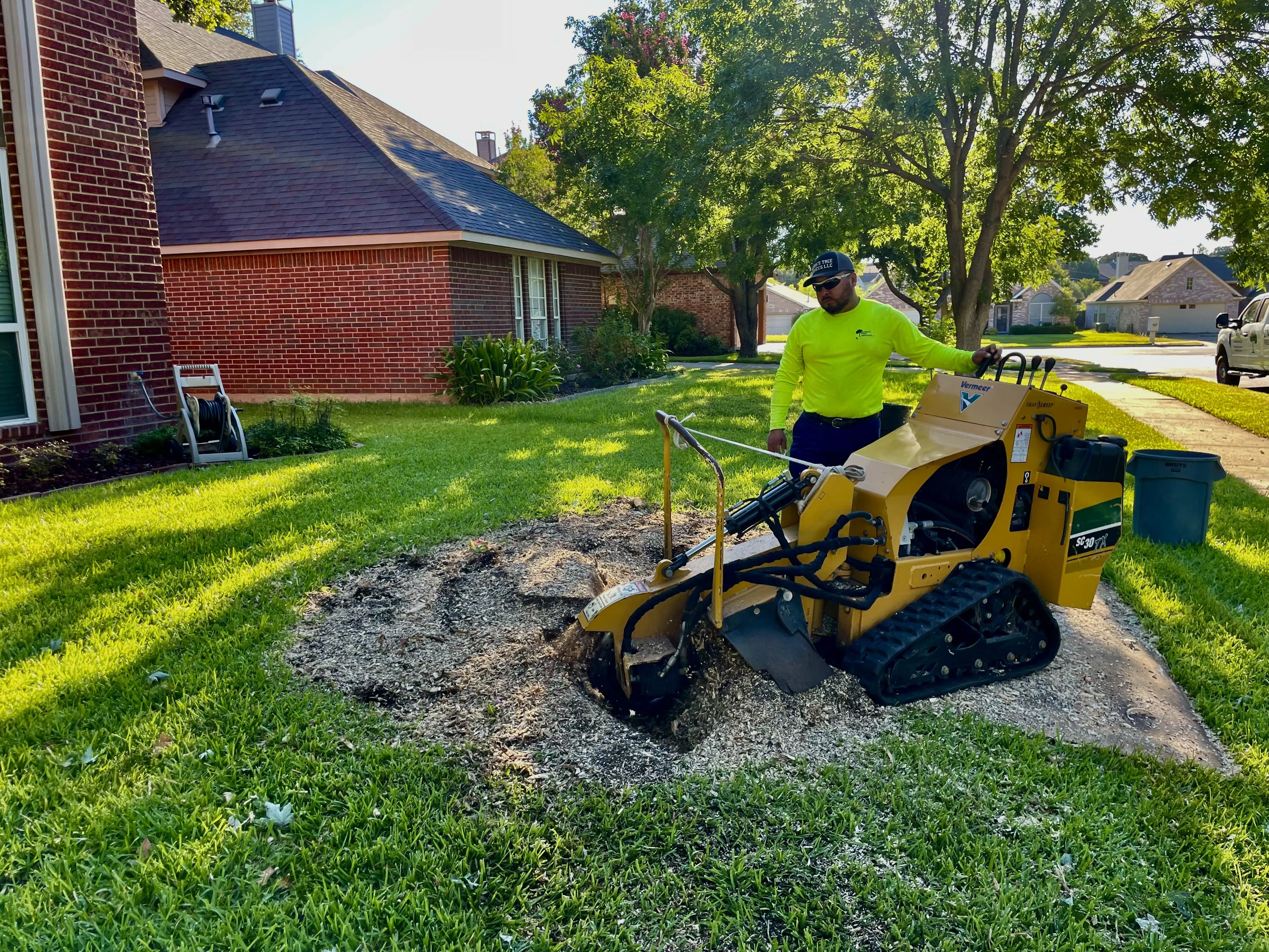 Mr. Sierra using a strump grinder to remove a stump in Southlake, TX